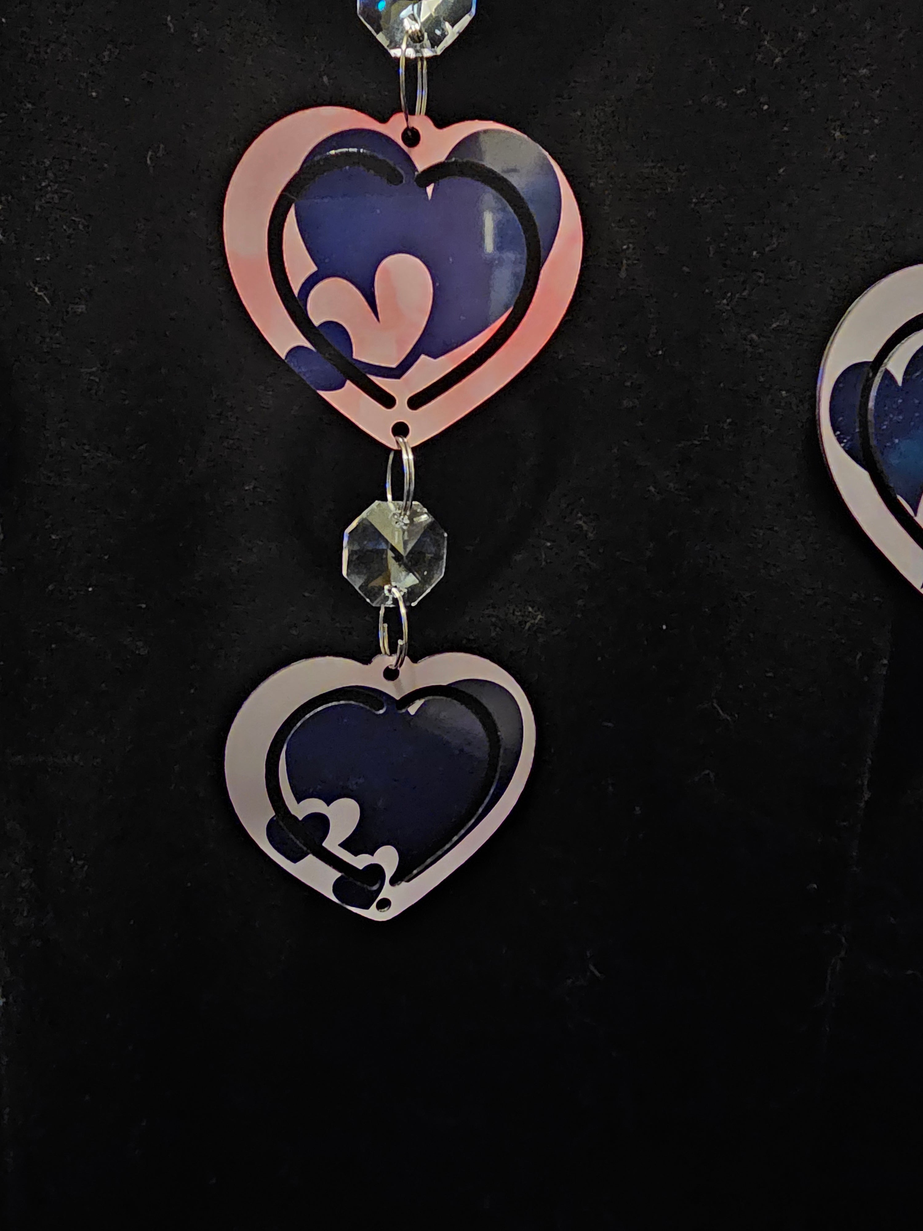 Heart Shaped Wind Spinner with a Loving Couple in the Sunset