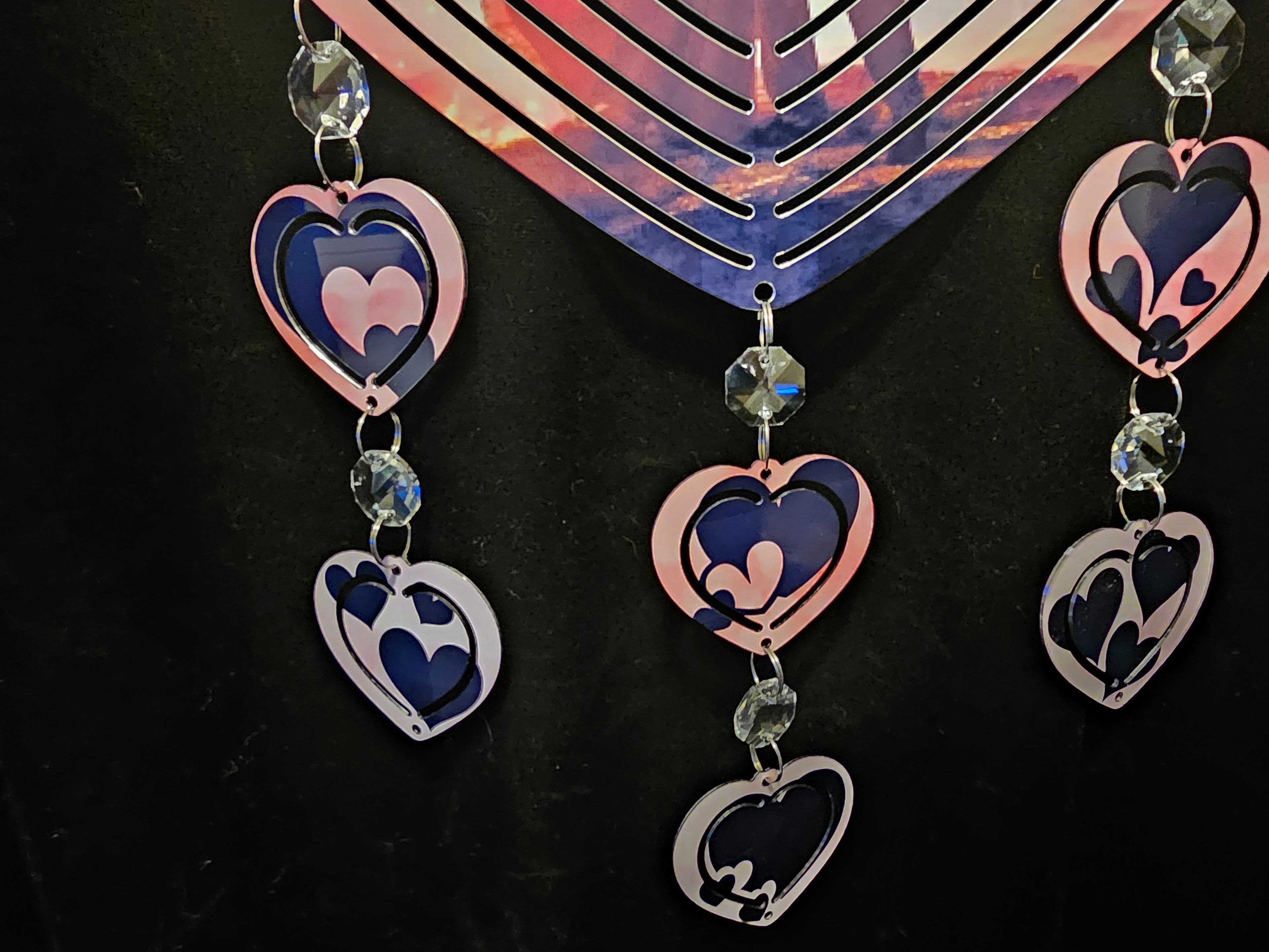 Heart Shaped Wind Spinner with a Loving Couple in the Sunset