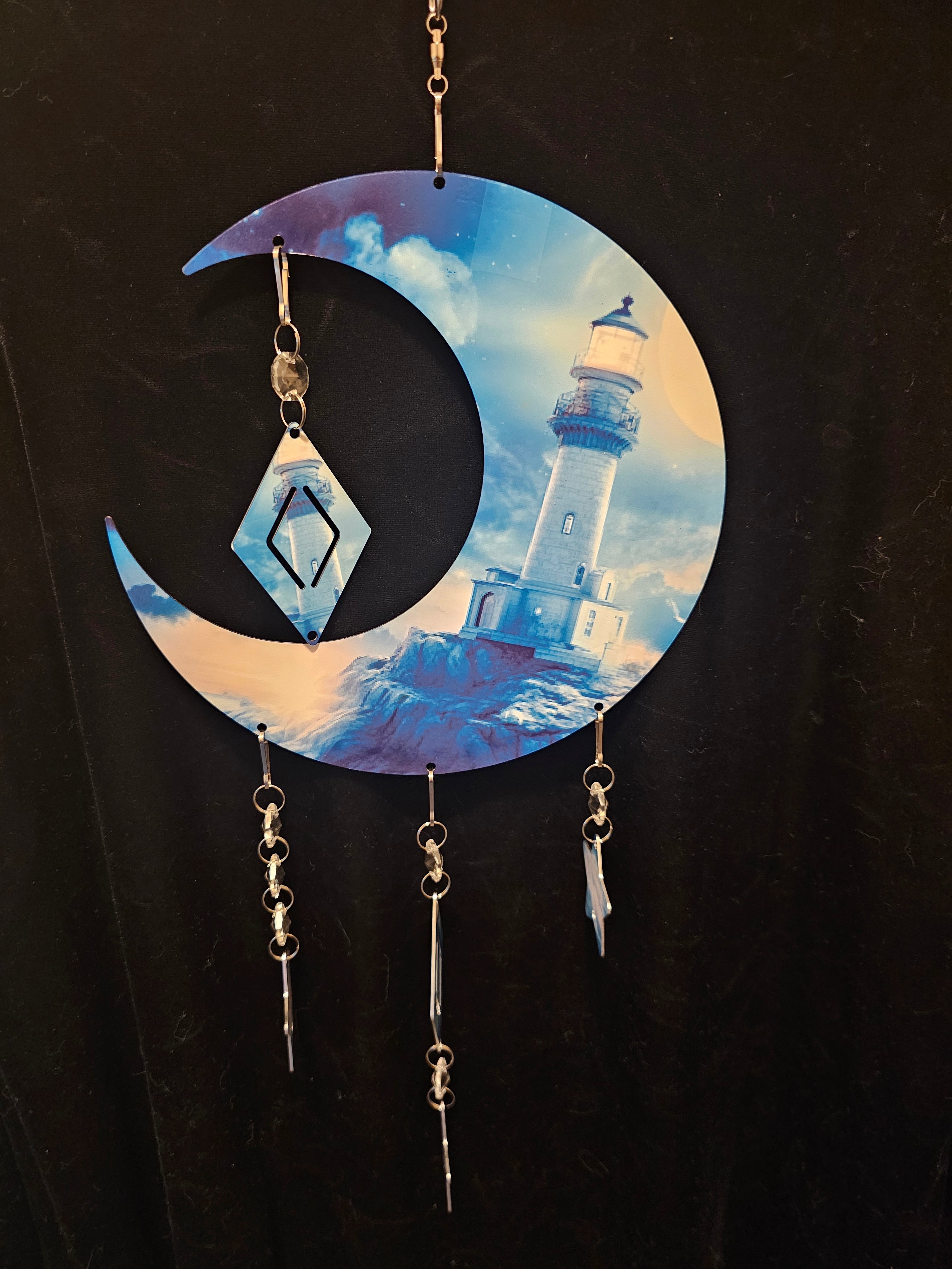 Moon Shaped Wind Spinner with a Lighthouse