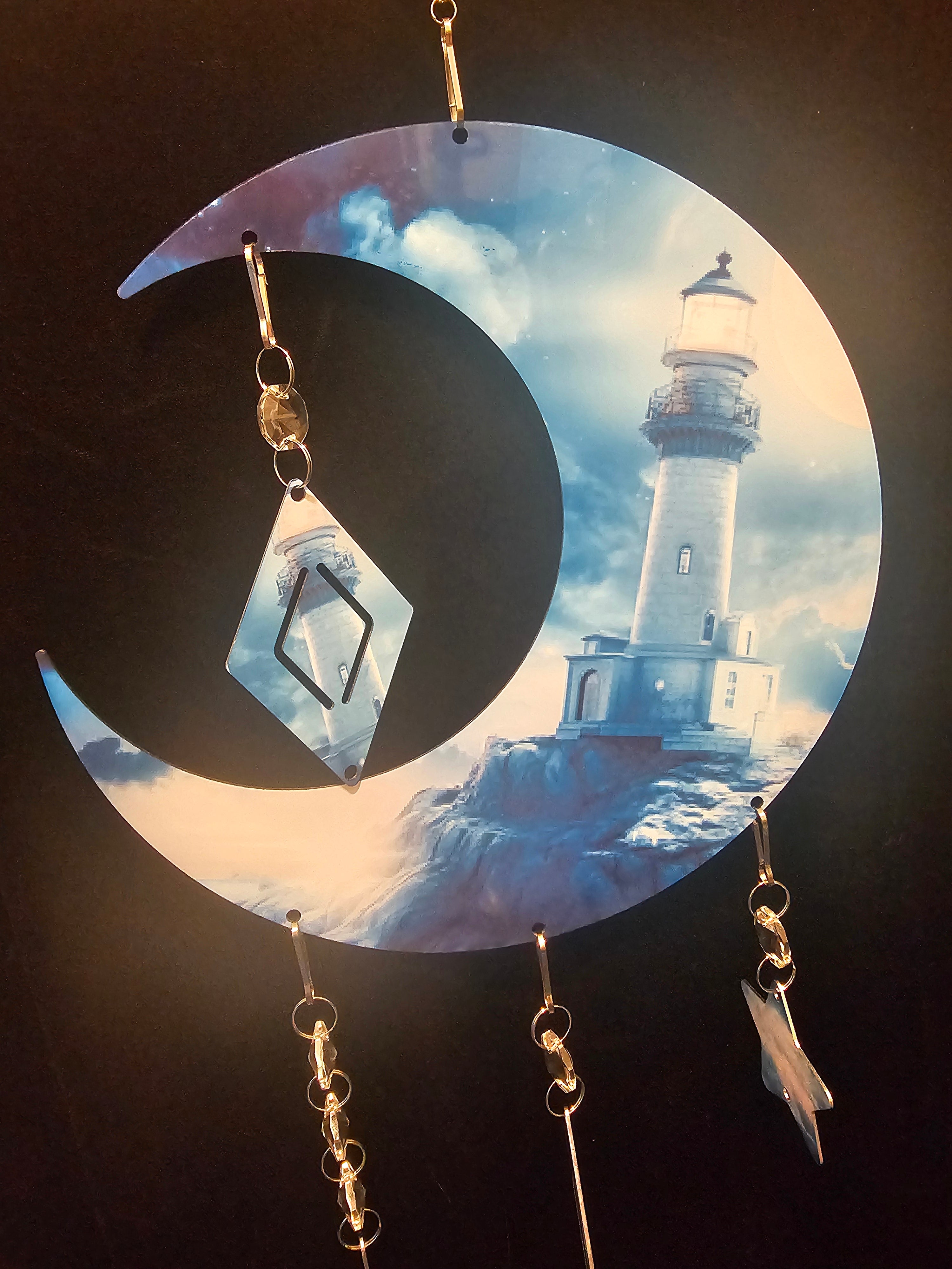 Moon Shaped Wind Spinner with a Lighthouse