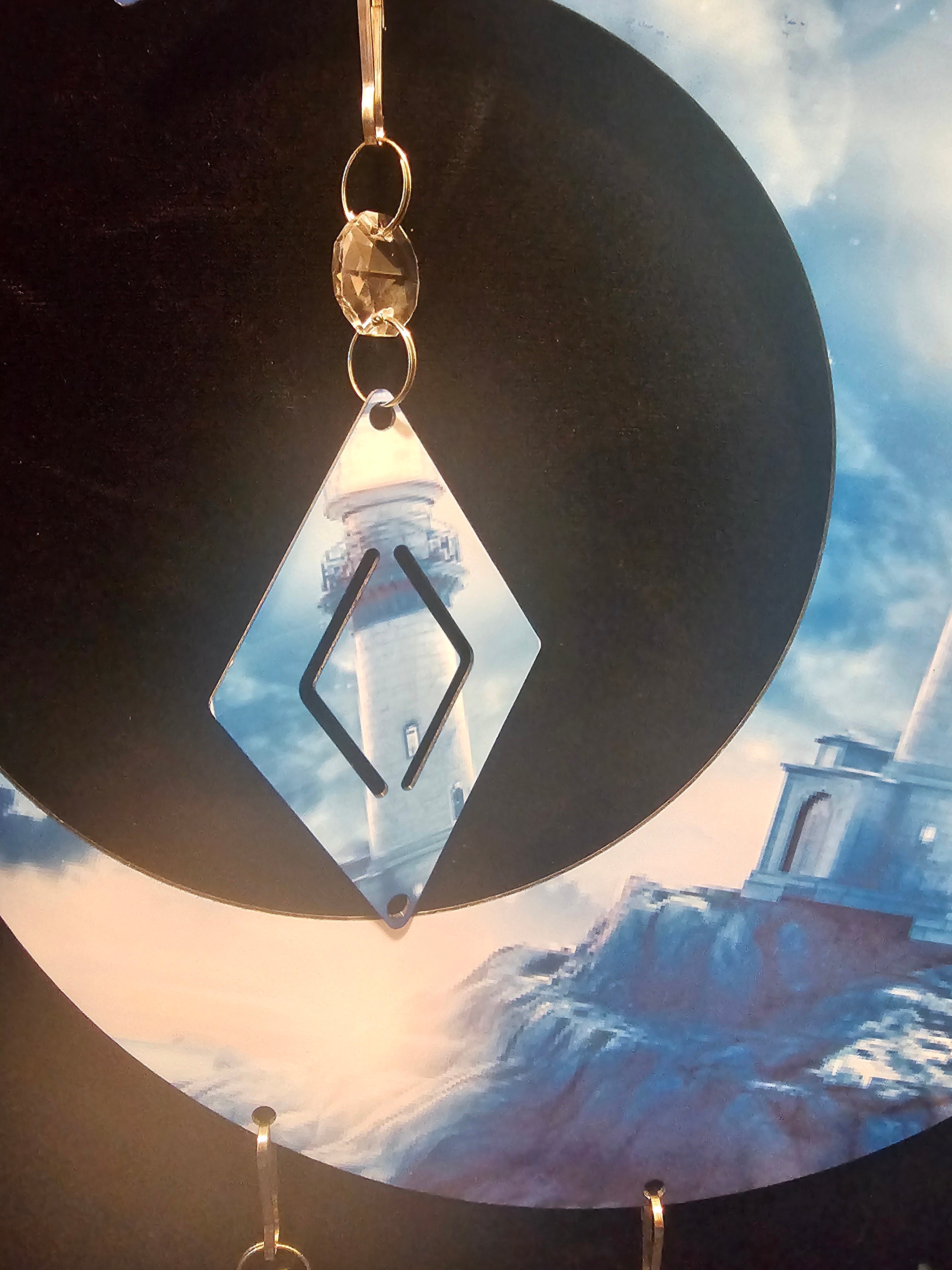 Moon Shaped Wind Spinner with a Lighthouse