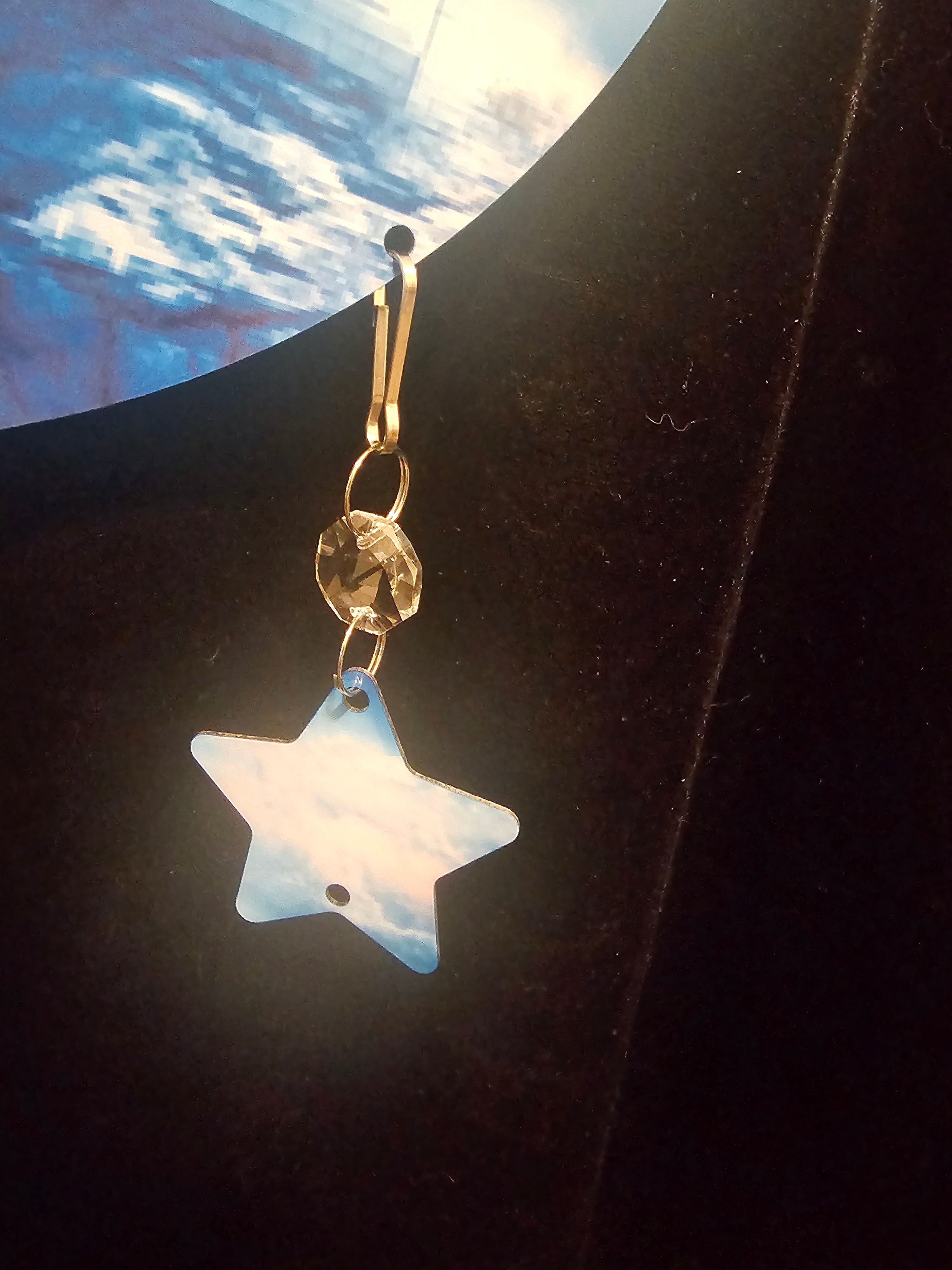 Moon Shaped Wind Spinner with a Lighthouse