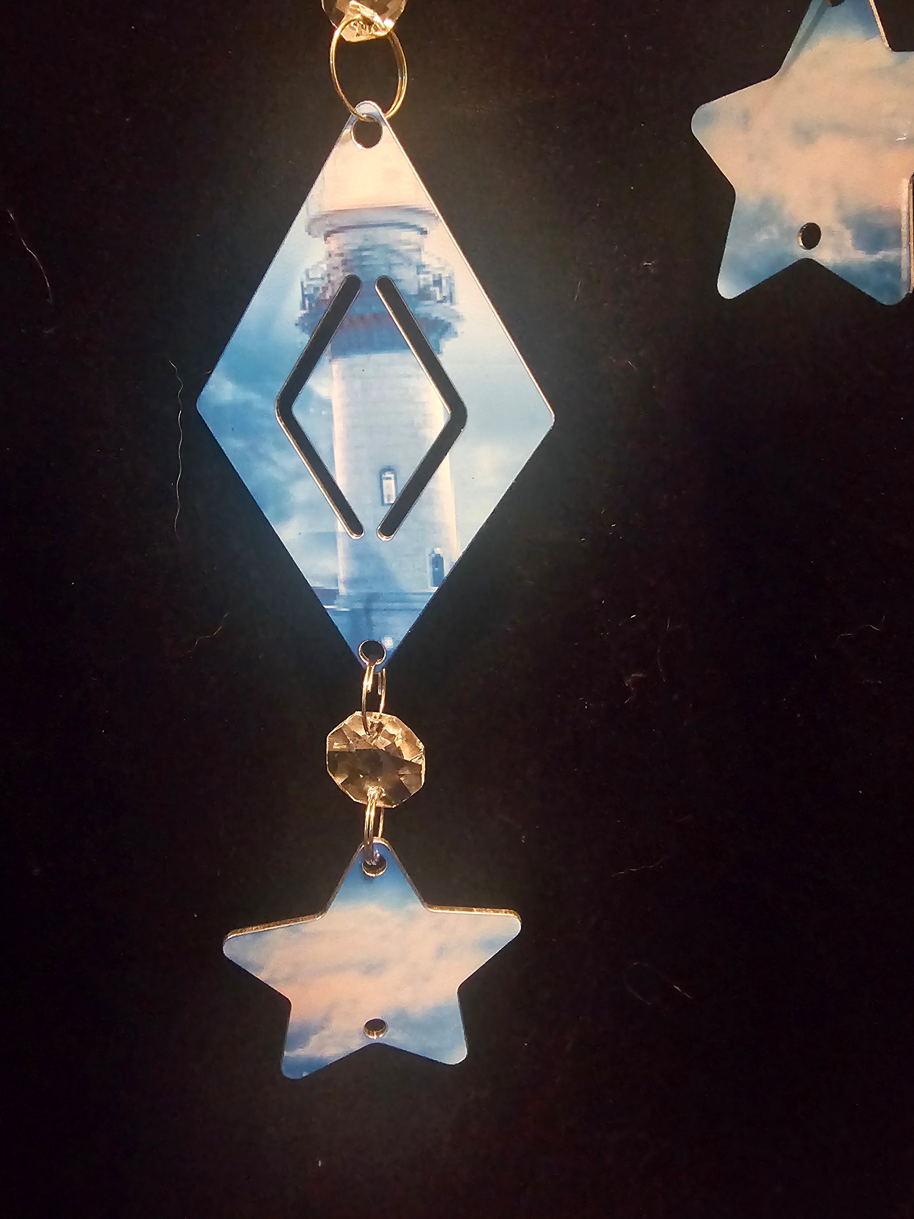 Moon Shaped Wind Spinner with a Lighthouse