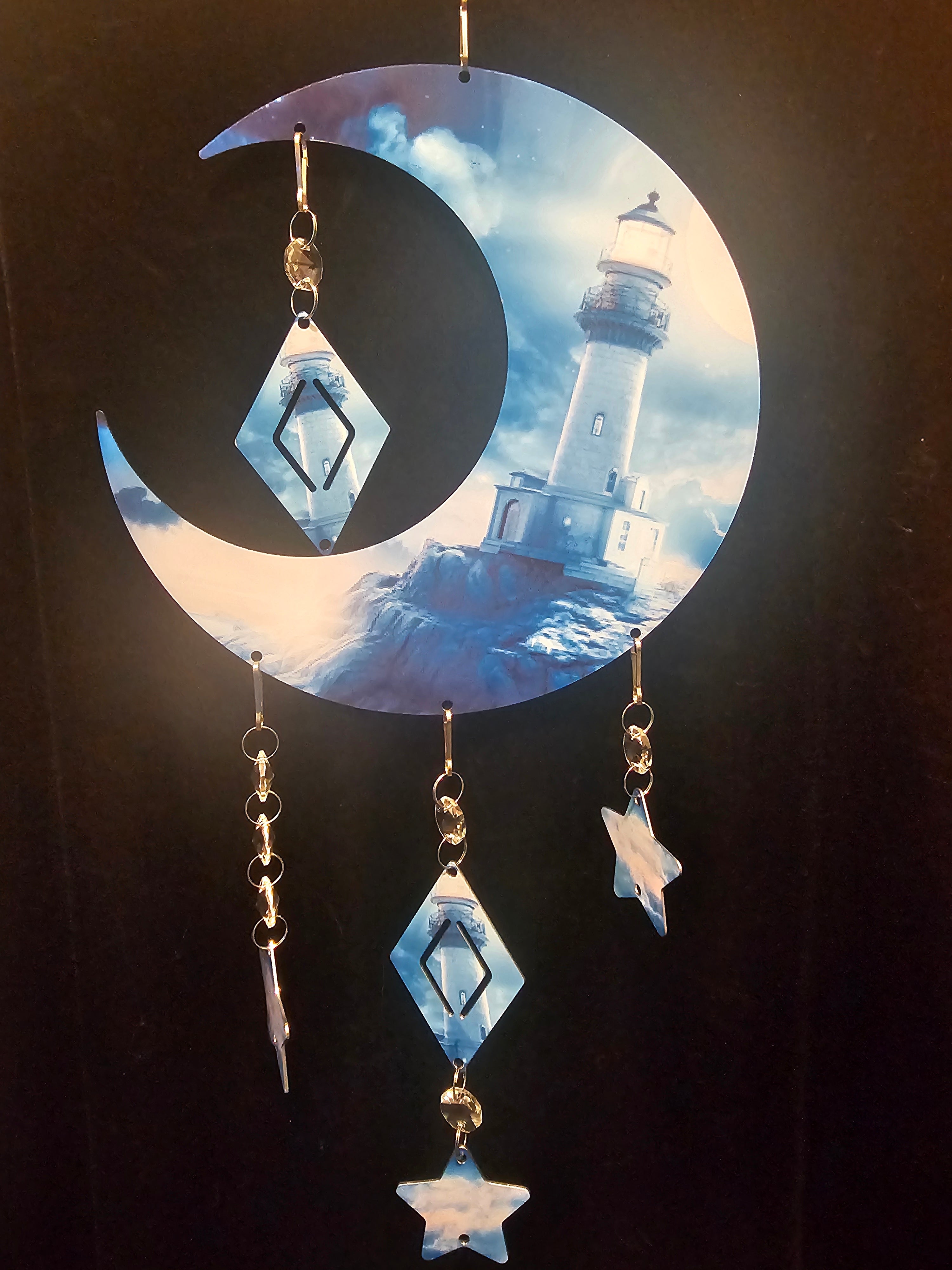 Moon Shaped Wind Spinner with a Lighthouse