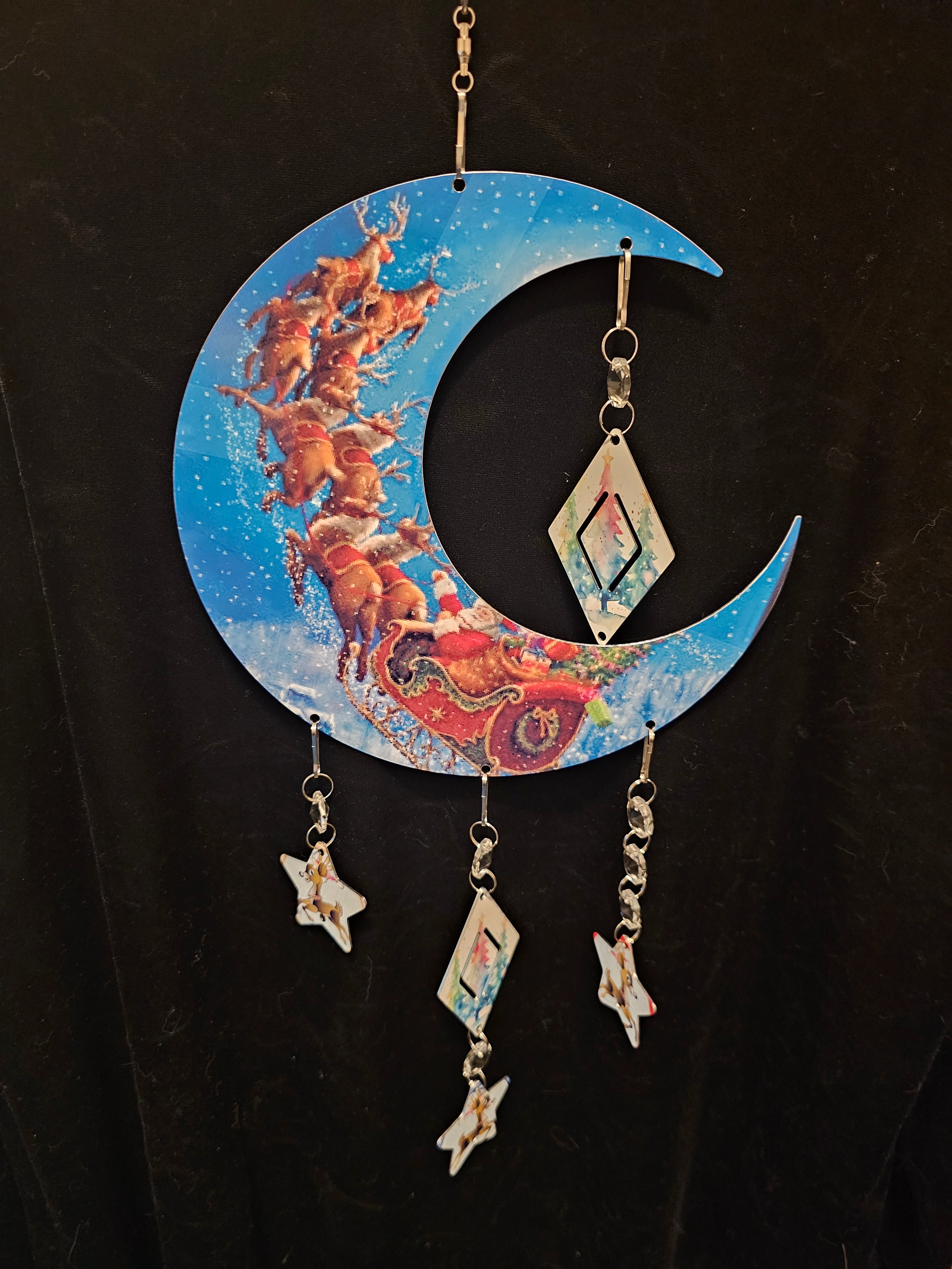 Moon Shaped Wind Spinner with the Reindeer Pulling Santa's Sleigh