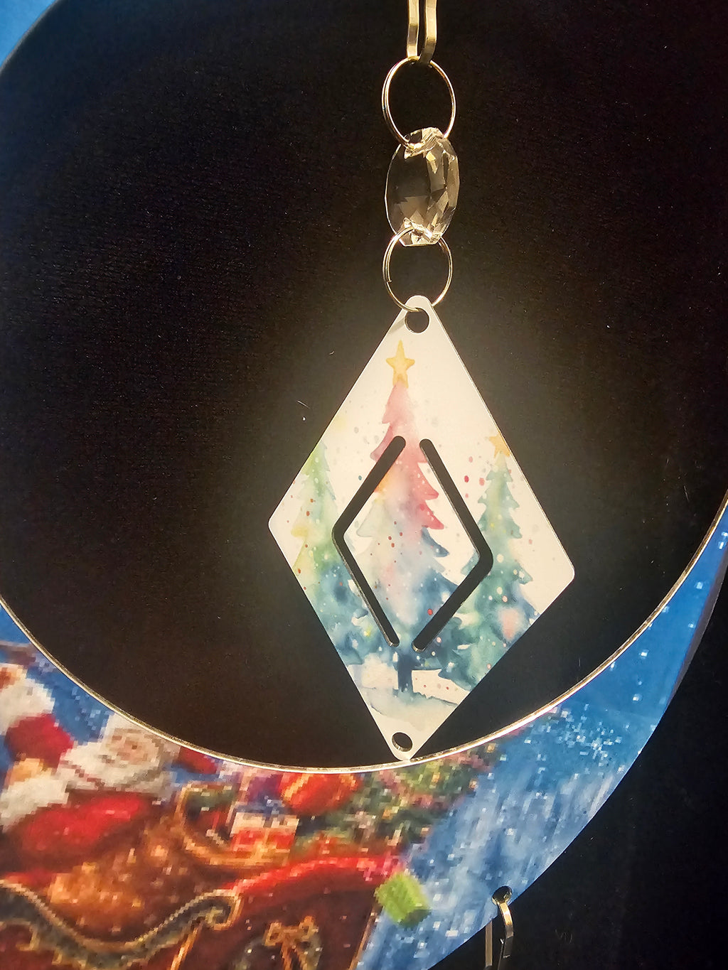 Moon Shaped Wind Spinner with the Reindeer Pulling Santa's Sleigh