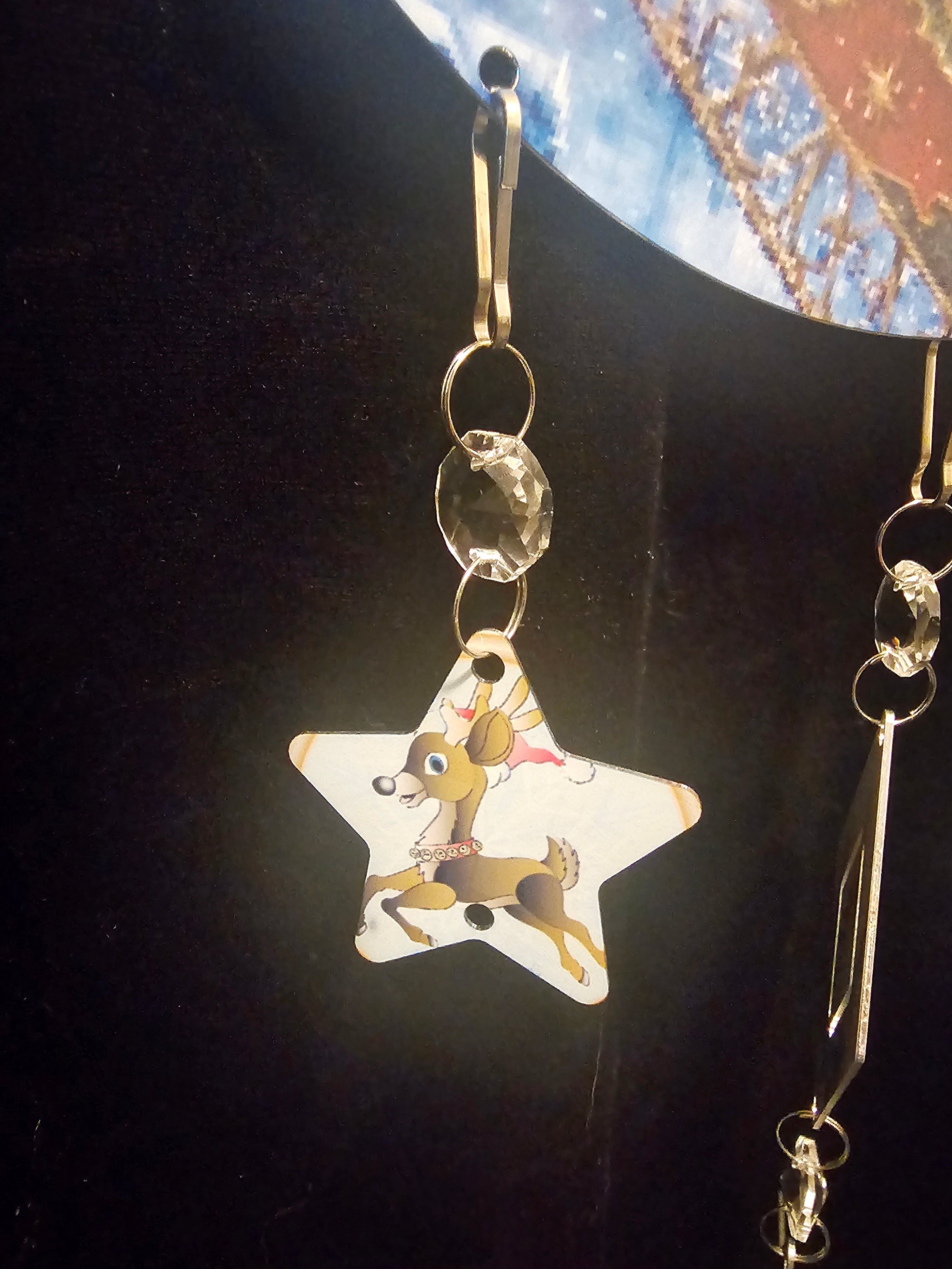 Moon Shaped Wind Spinner with the Reindeer Pulling Santa's Sleigh